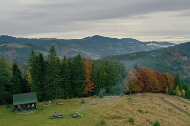 Photo of Aerial view of beautiful mountain landscape with house near forest