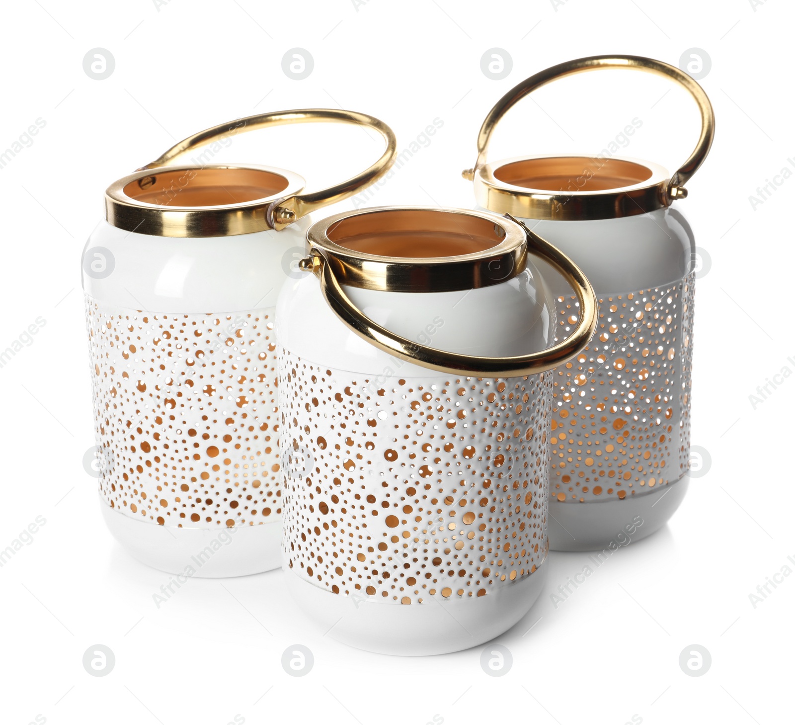 Photo of Stylish gold candle holders on white background