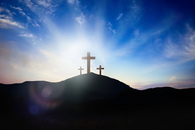 Image of Christian croses on hill outdoors at sunrise. Resurrection of Jesus