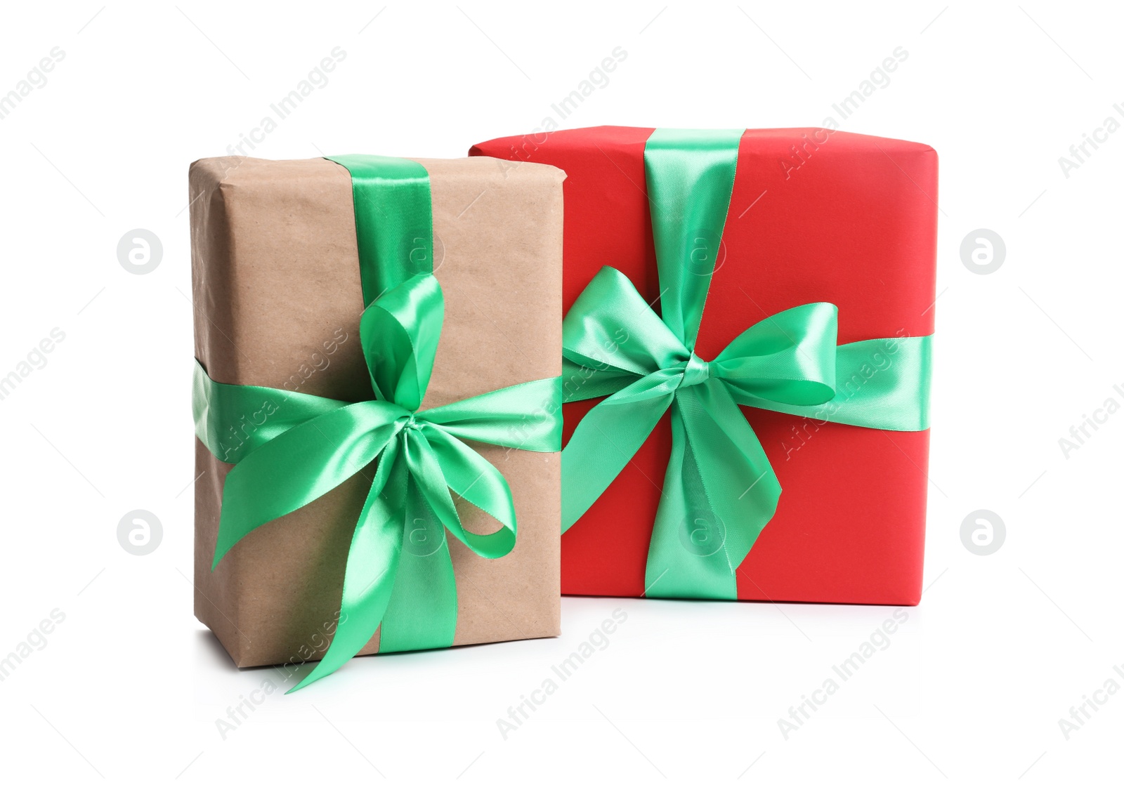 Photo of Beautifully wrapped gift boxes on white background