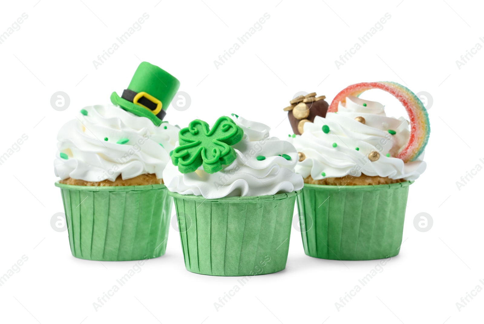 Photo of St. Patrick's day party. Tasty festively decorated cupcakes isolated on white