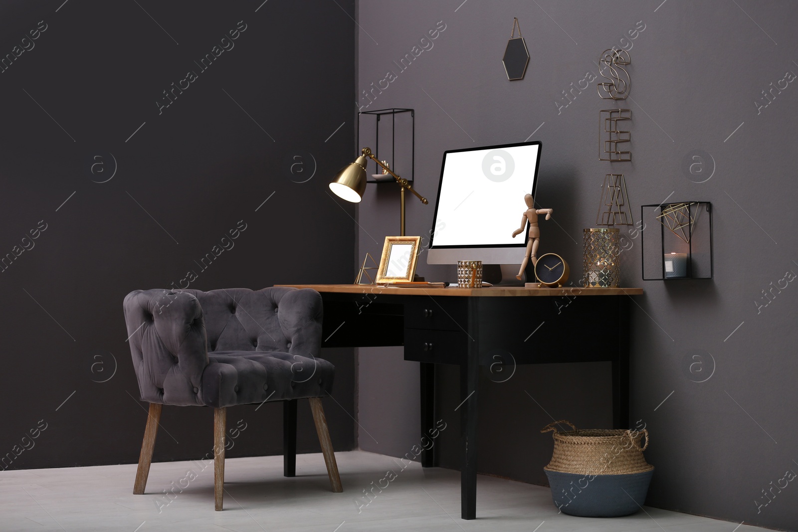 Photo of Modern computer on table in stylish office interior