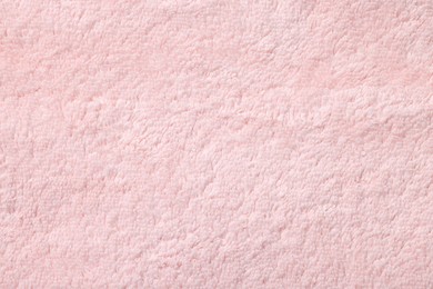 Photo of Texture of soft pink fabric as background, top view