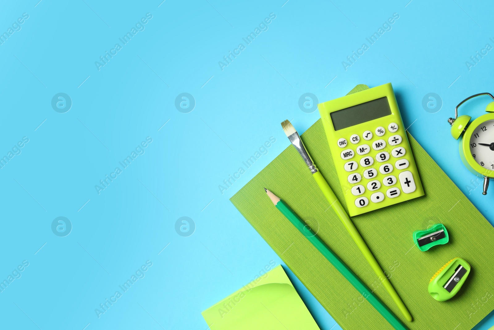 Photo of Flat lay composition with different school stationery on light blue background, space for text. Back to school