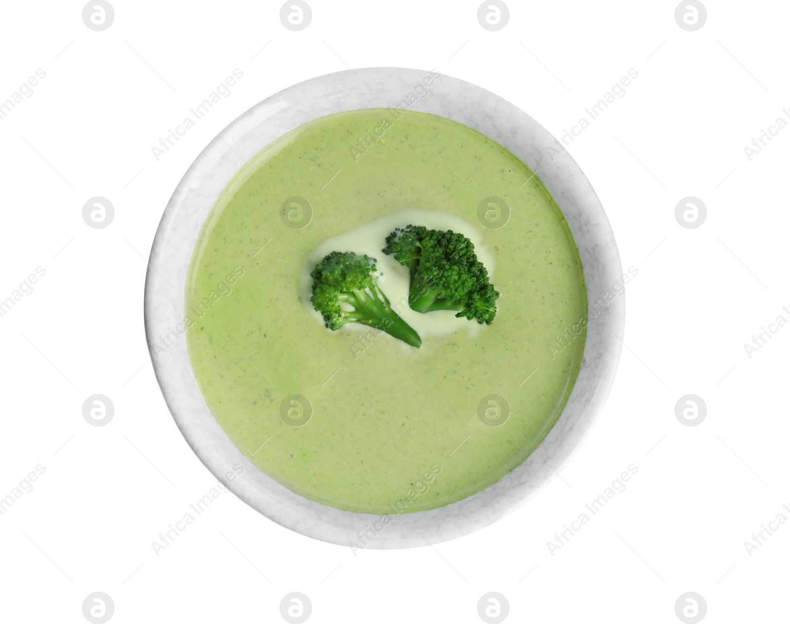 Photo of Delicious broccoli cream soup isolated on white, top view