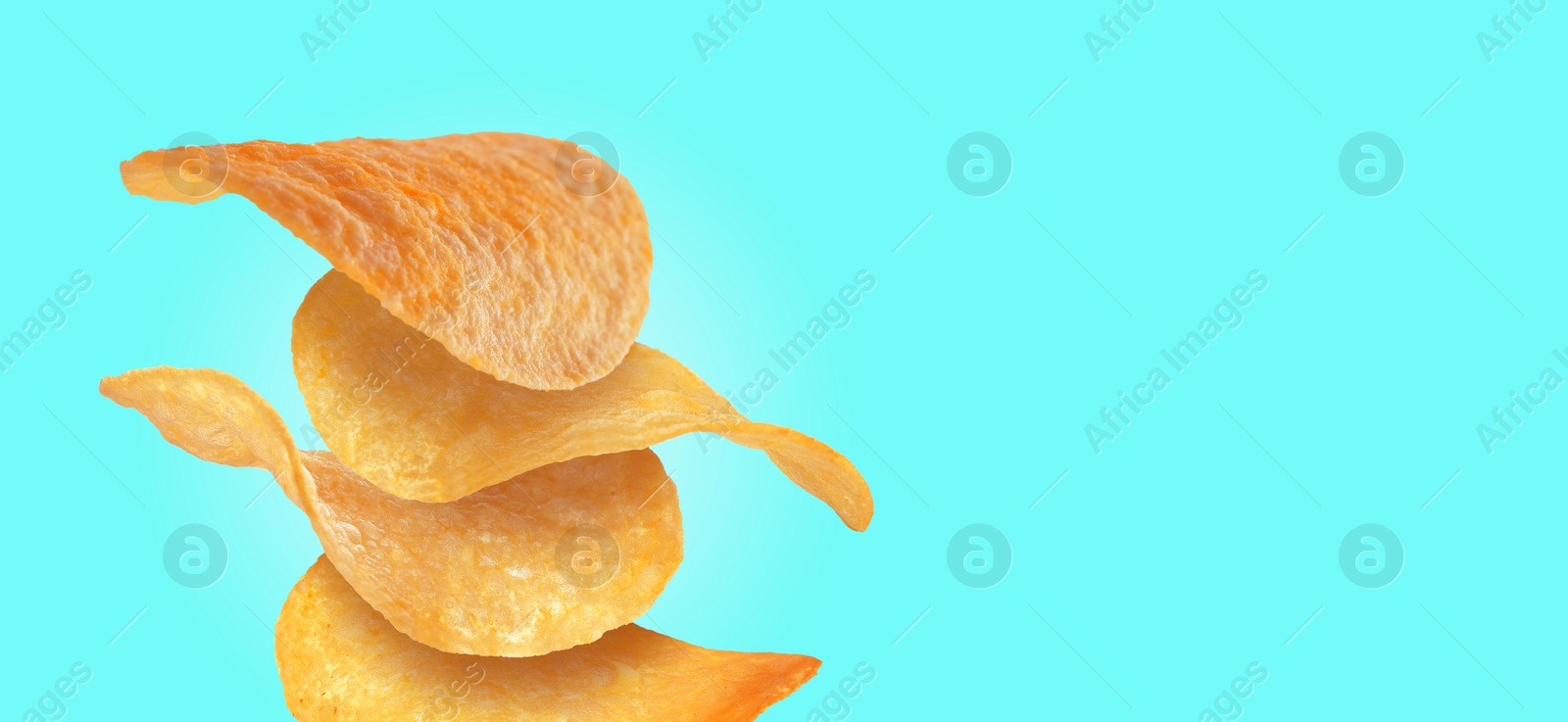 Image of Stack of tasty potato chips on cyan background, space for text