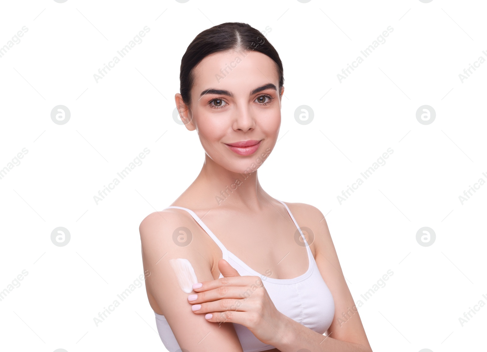 Photo of Beautiful woman with smear of body cream on her arm against white background