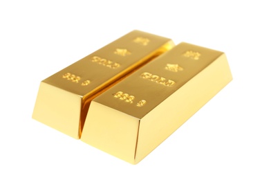 Photo of Precious shiny gold bars on white background