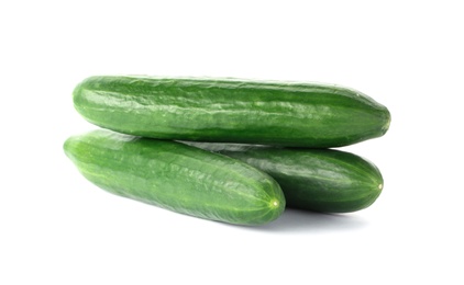 Photo of Fresh green cucumbers on white background