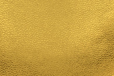 Image of Golden textured surface as background, closeup view