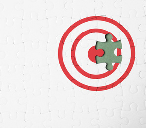 Image of Purpose concept. White puzzle with missing piece on green background, top view