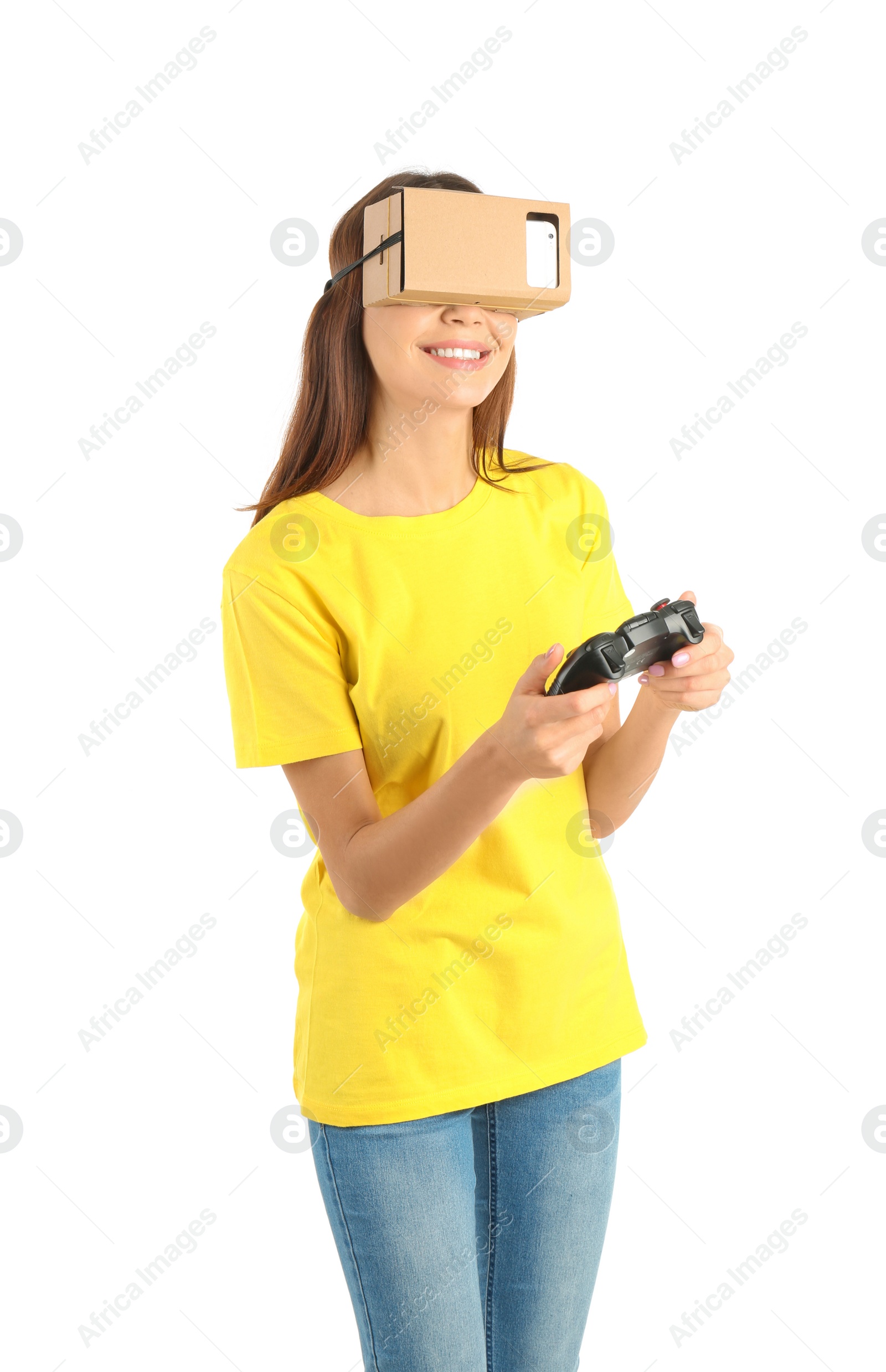 Photo of Young woman using cardboard virtual reality headset, isolated on white