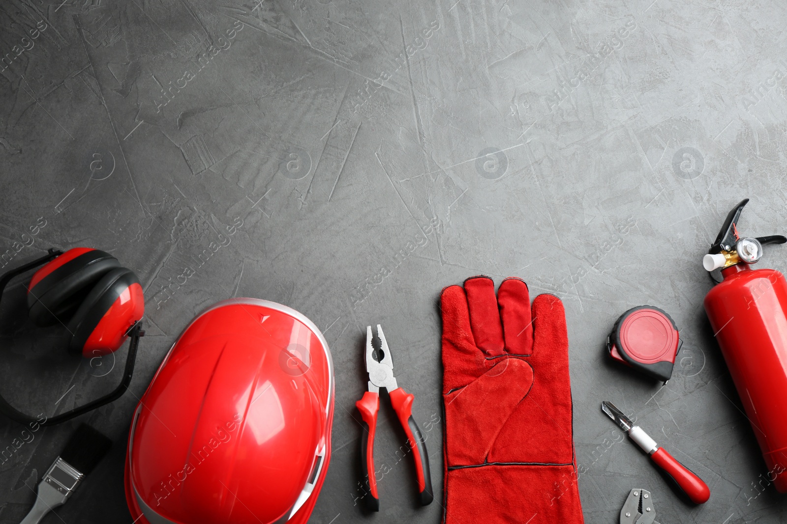 Photo of Flat lay composition with construction tools on grey background, space for text