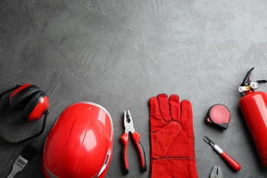 Photo of Flat lay composition with construction tools on grey background, space for text