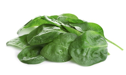 Heap of fresh green healthy baby spinach leaves isolated on white