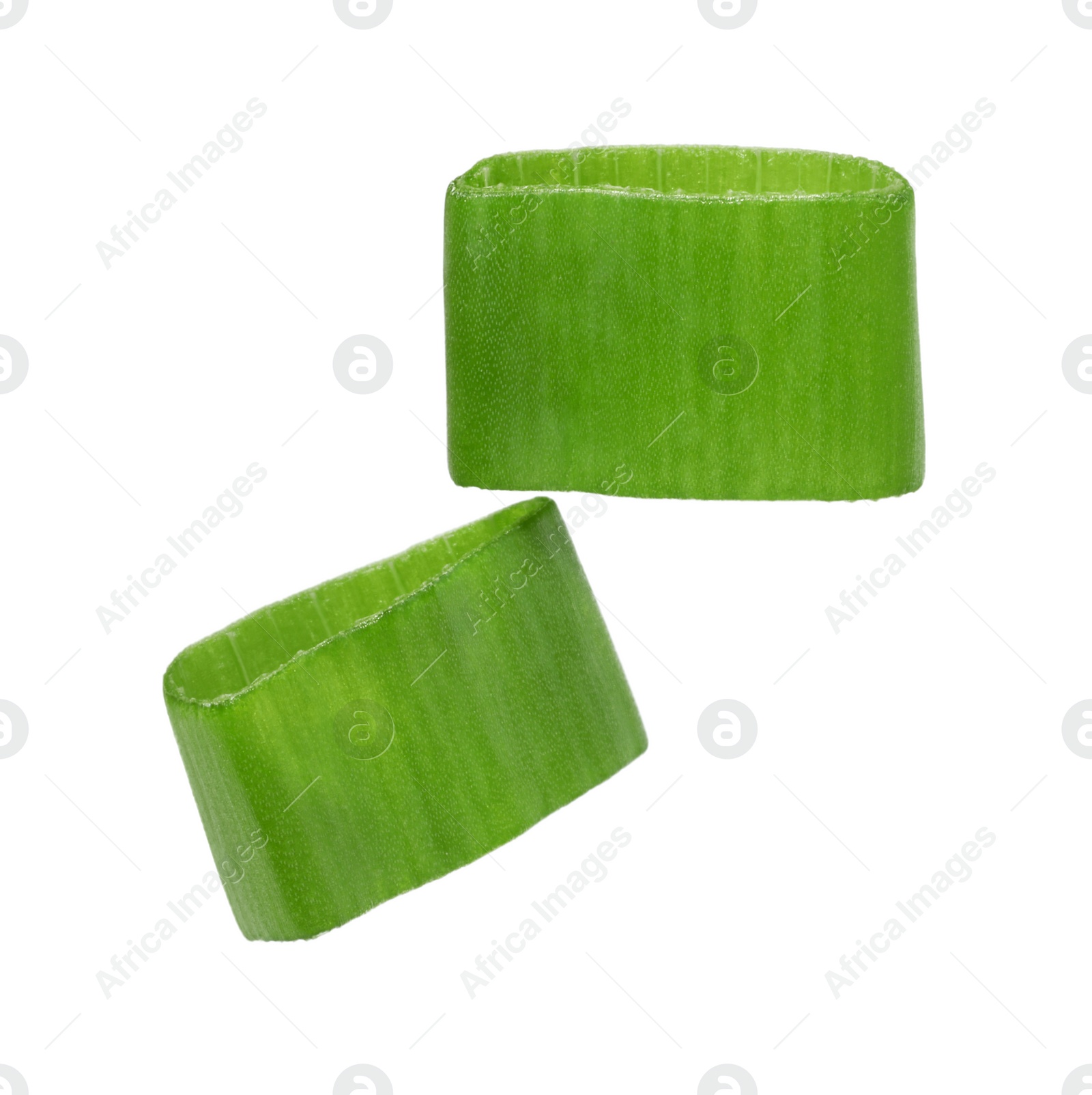 Photo of Pieces of fresh green onion isolated on white