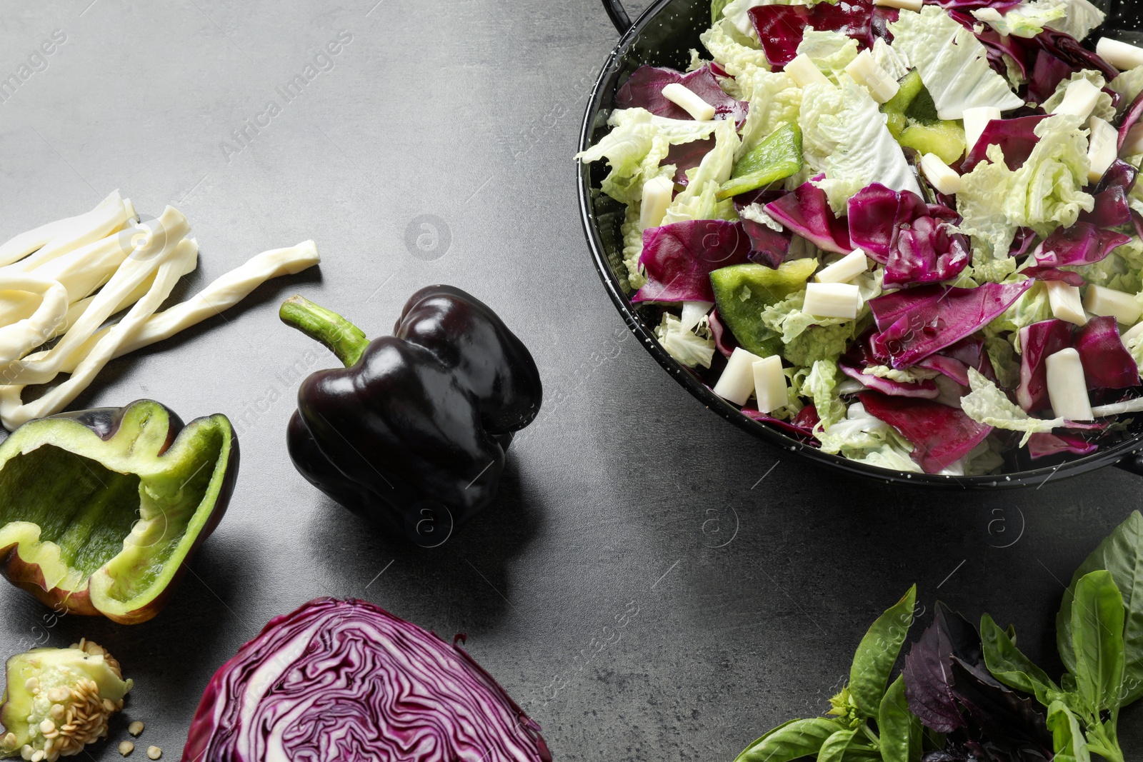 Photo of Delicious salad with Chinese cabbage, bell pepper and suluguni cheese on grey table