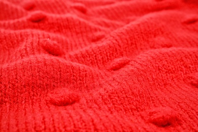 Texture of cozy warm sweater as background, closeup