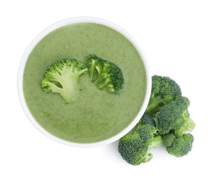 Delicious broccoli cream soup in bowl isolated on white, top view