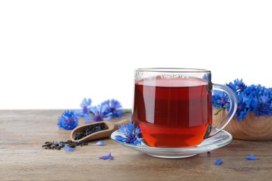 Cornflower tea and fresh flowers on wooden table