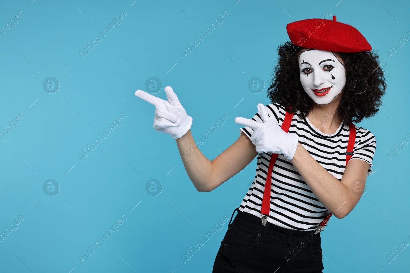 Photo of Funny mine with beret posing on light blue background, space for text