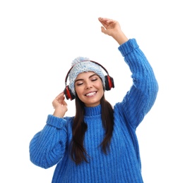 Photo of Young woman listening to music with headphones on white background