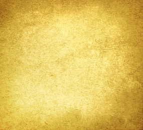 Image of Golden textured surface as background, closeup view