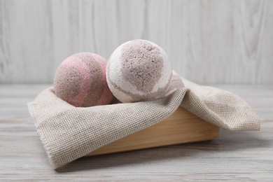Bath bombs in crate on wooden table