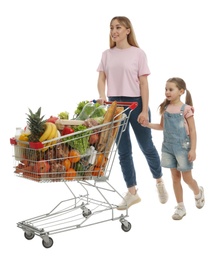 Mother and daughter with full shopping cart on white background