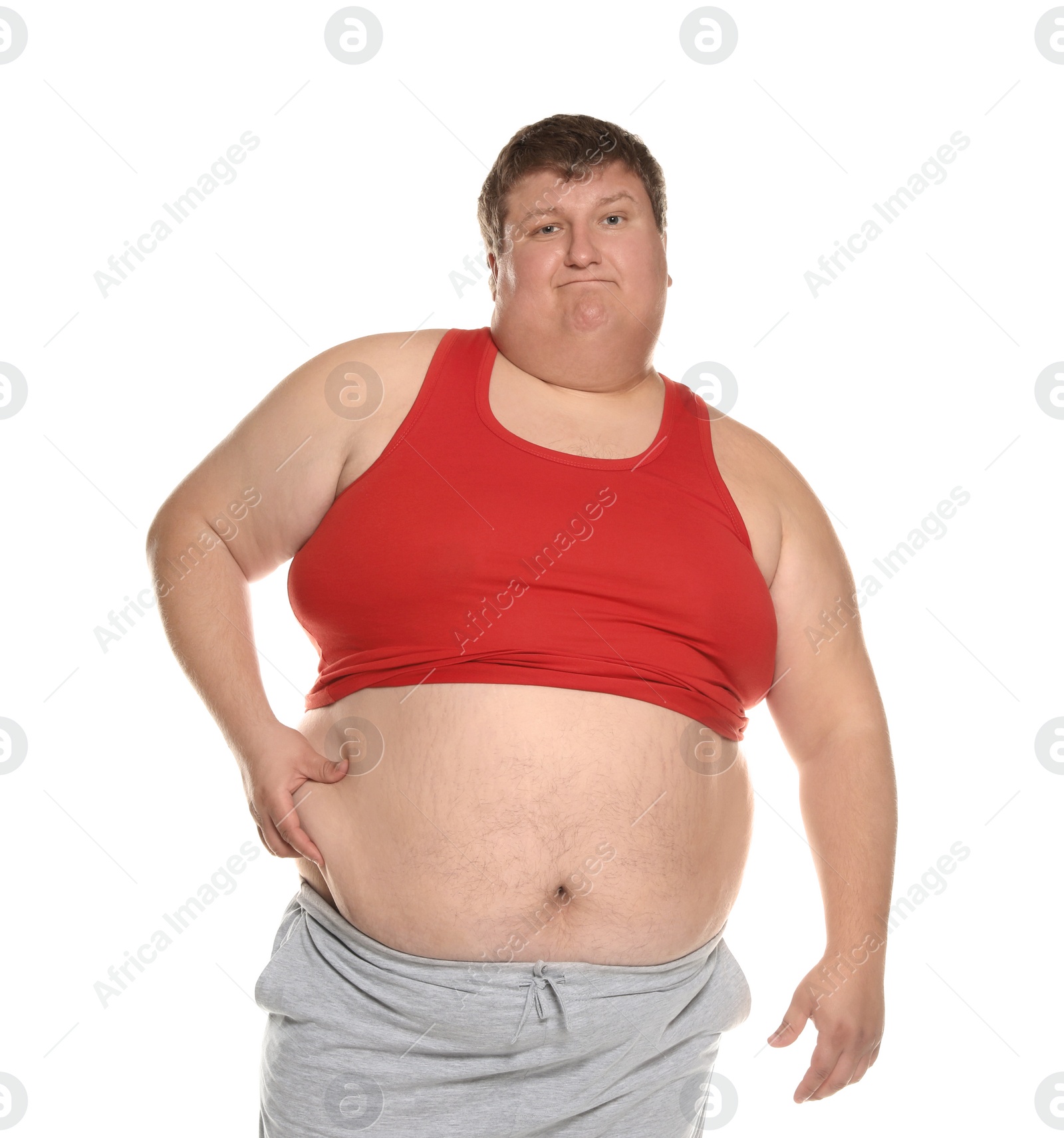 Photo of Emotional overweight man posing on white background