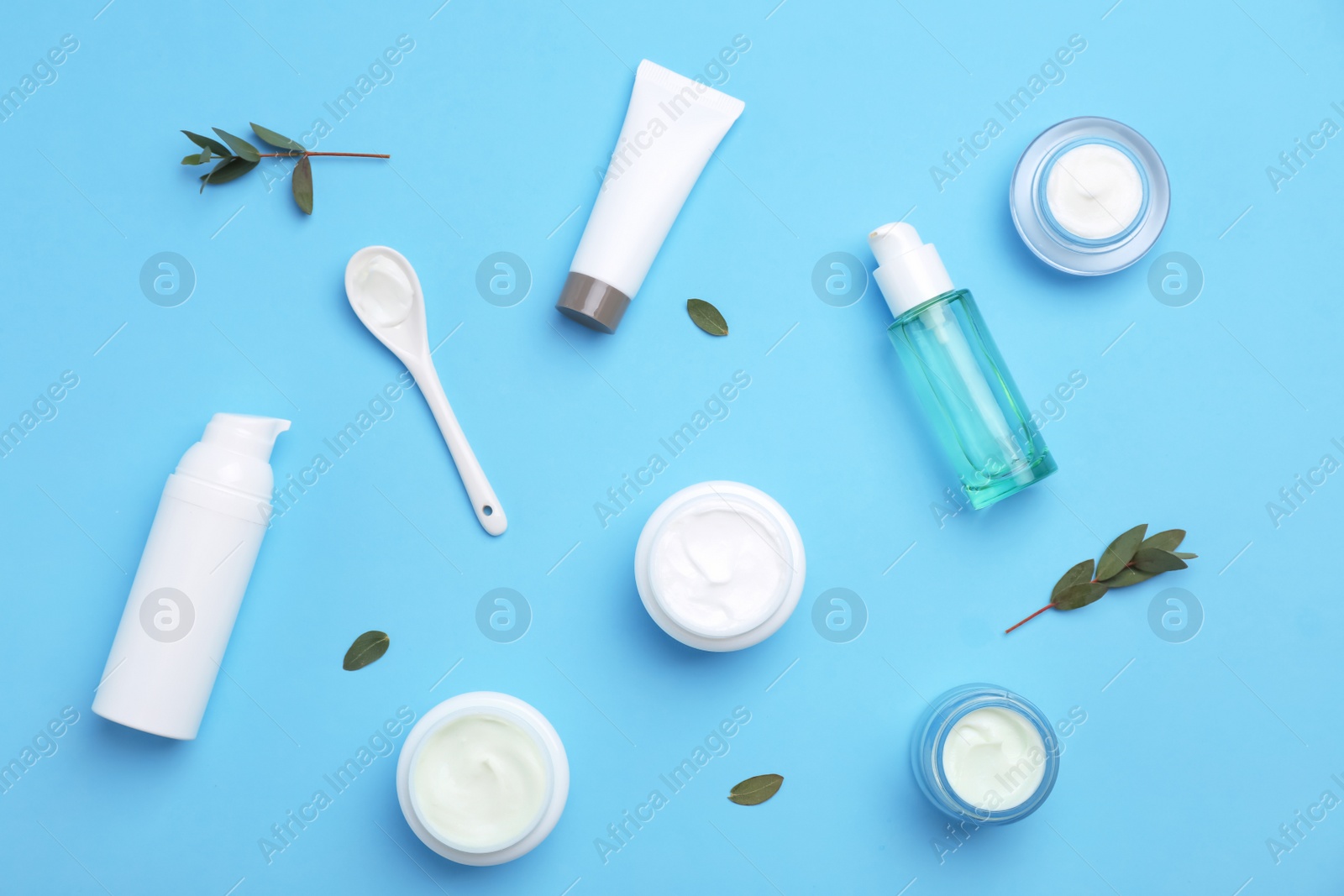 Photo of Flat lay composition with cosmetic products on color background