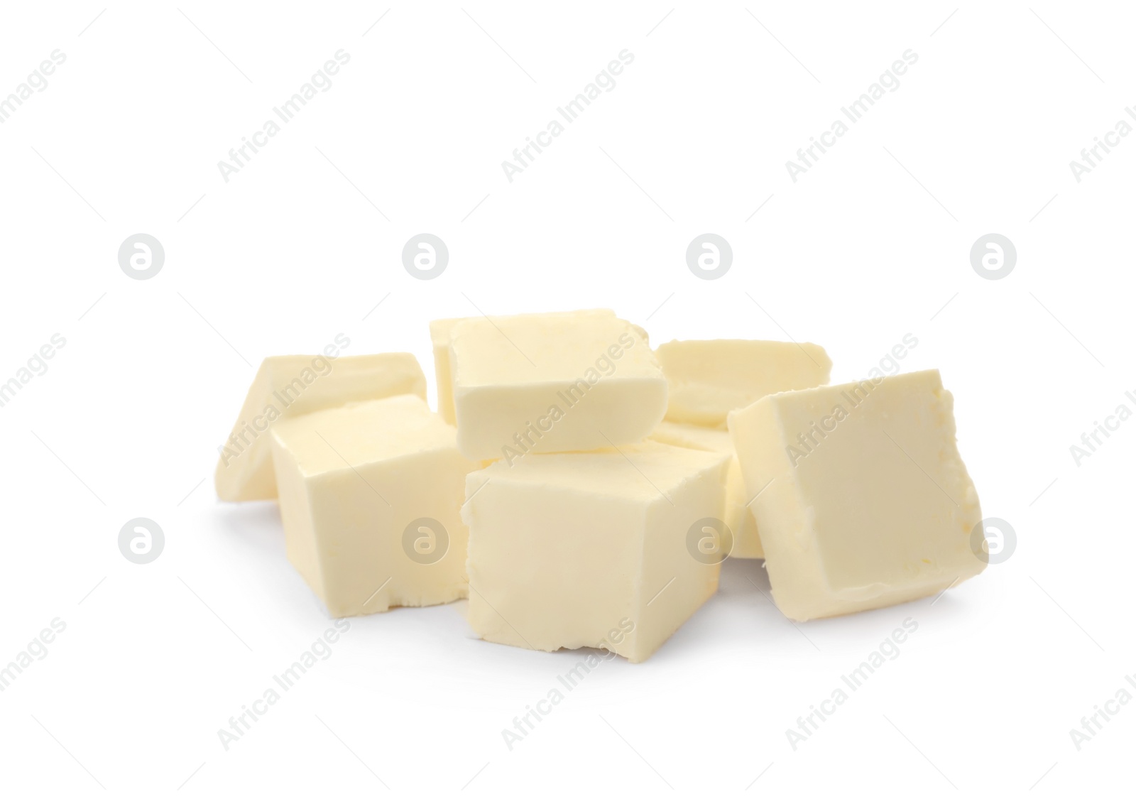 Photo of Cubes of tasty fresh butter on white background