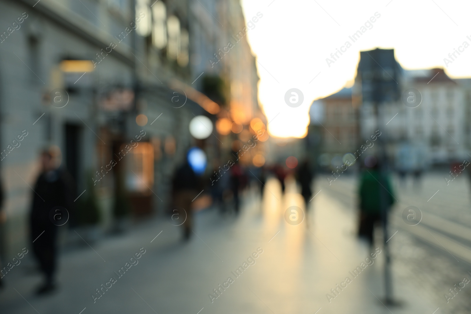 Photo of Blurred view of people walking on city street