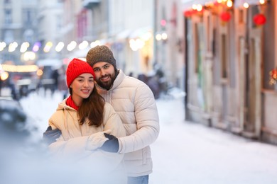 Photo of Lovely couple spending time together on city street