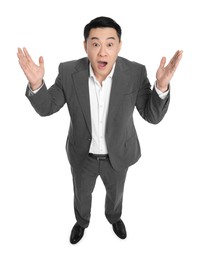 Shocked businessman in suit posing on white background, above view