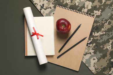 Photo of Stationery, apple and diploma on color background, flat lay. Military education