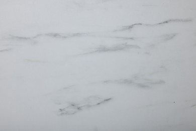 Photo of Texture of white marble surface as background, closeup