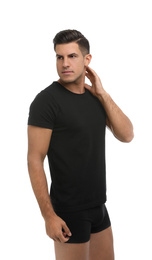 Handsome man in black underwear and t-shirt on white background