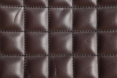 Brown natural leather with seams as background, top view