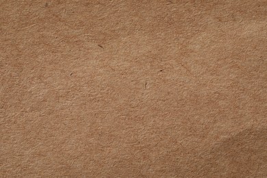 Texture of kraft paper sheet as background, closeup