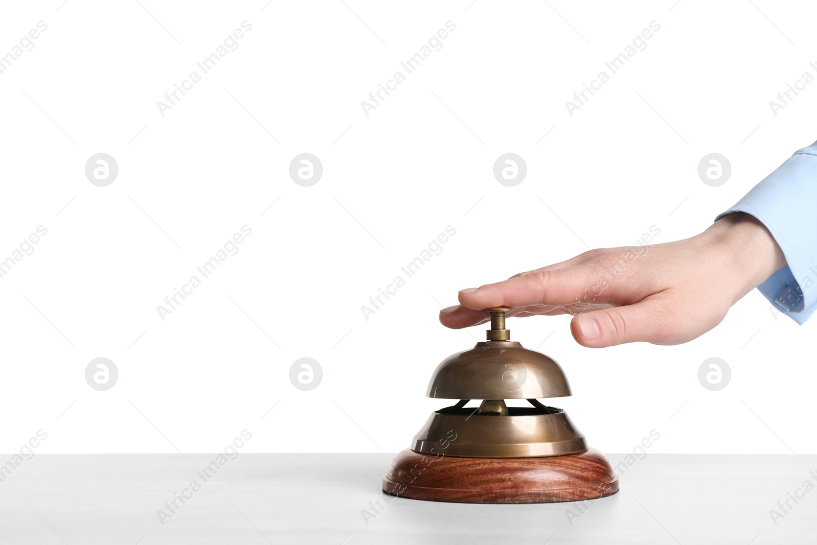 Photo of Woman ringing hotel service bell on white background