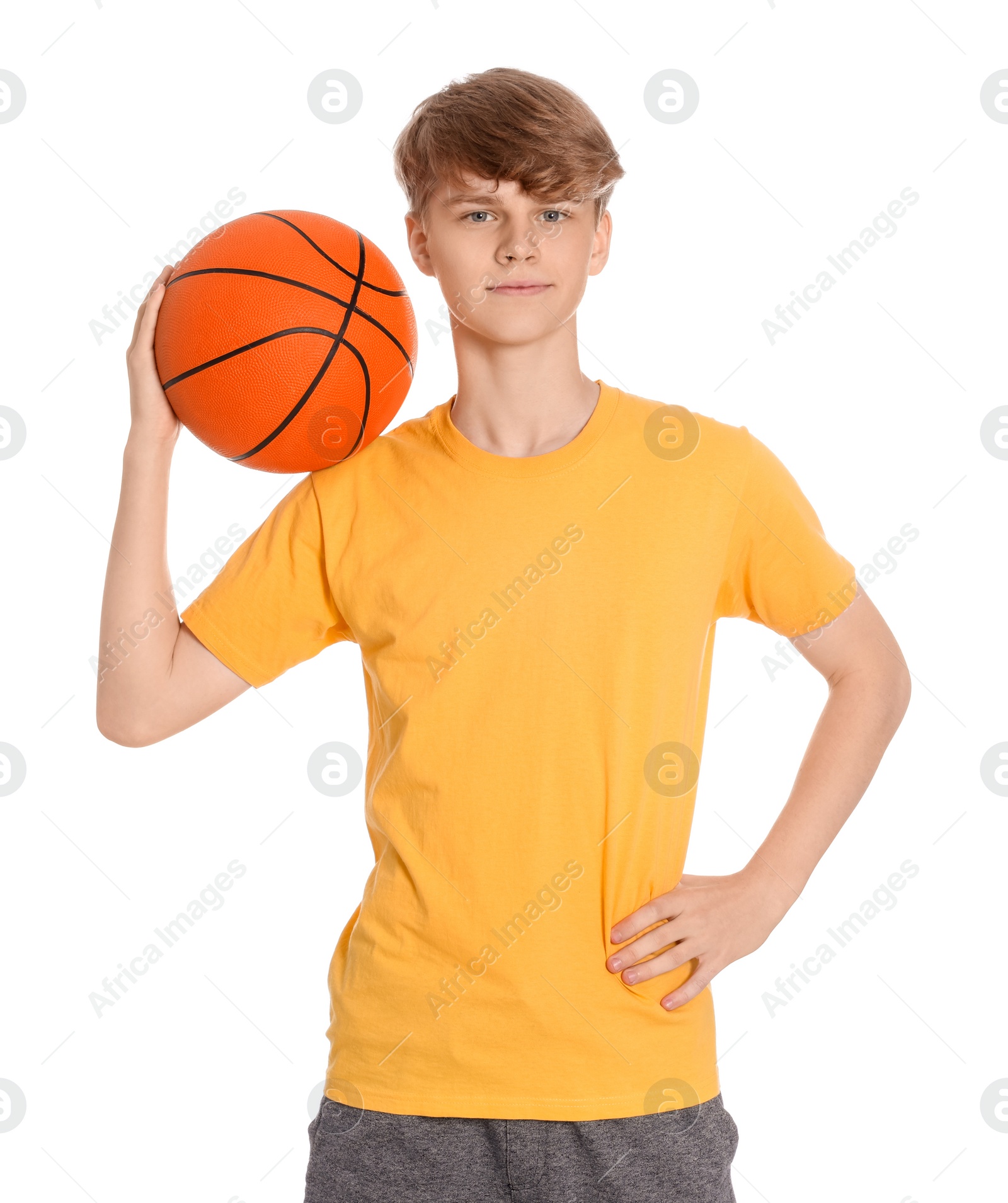 Photo of Teenage boy with basketball ball on white background