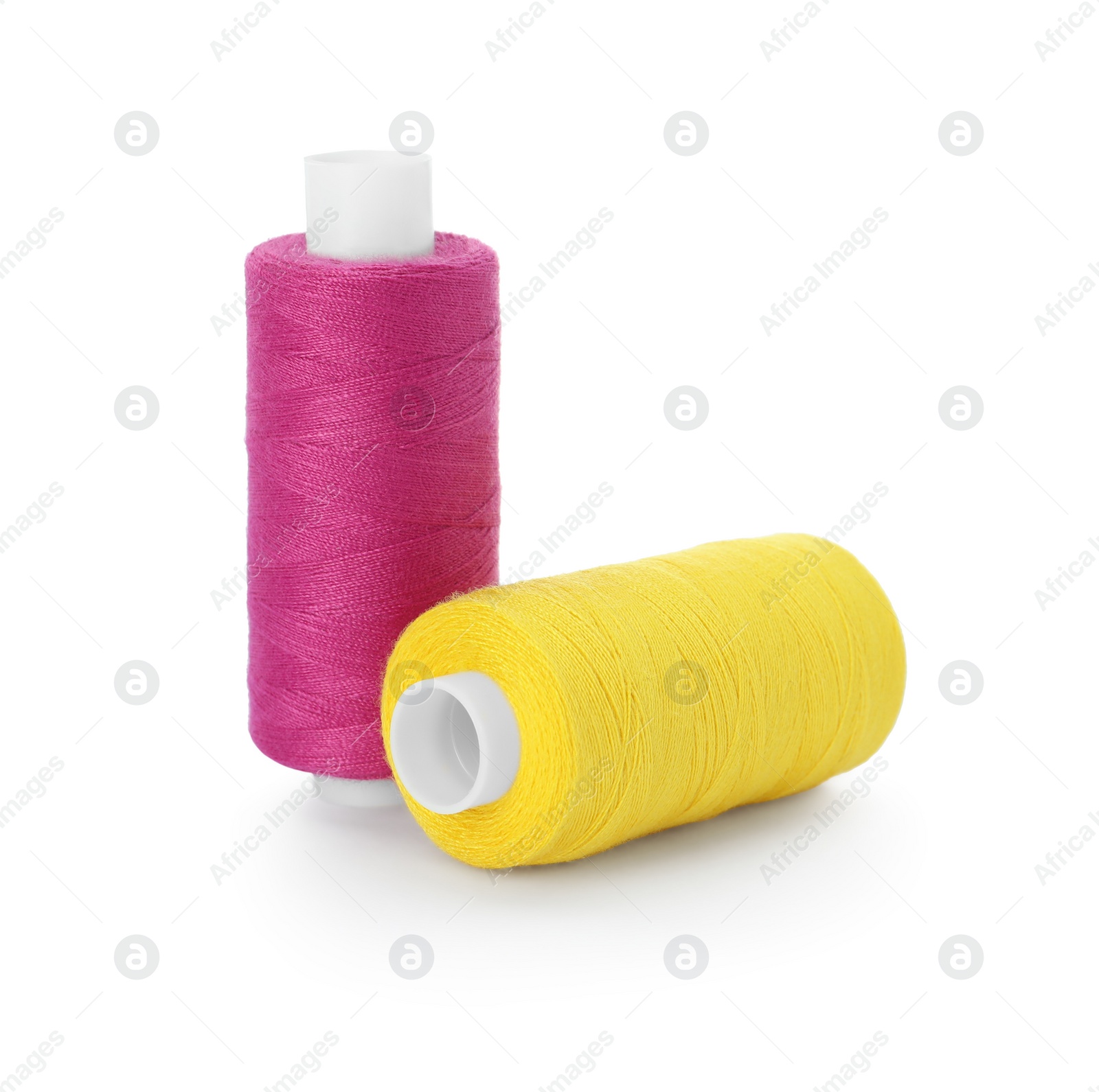 Photo of Different colorful sewing threads on white background