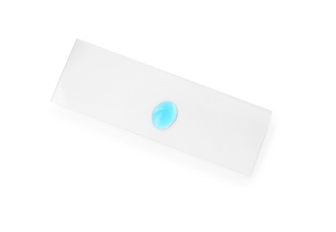 Photo of Microscope slide with sample of light blue liquid isolated on white, top view