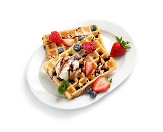 Photo of Plate with yummy waffles, berries and ice cream on white background