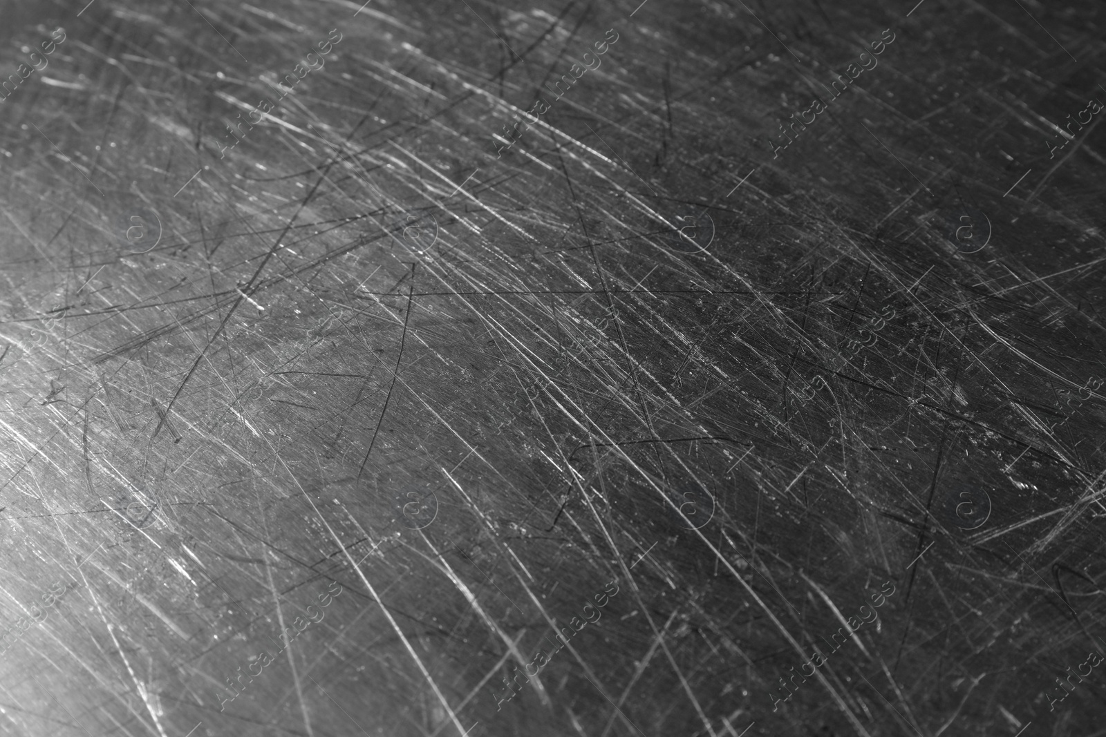 Photo of Texture of scratched metallic surface as background, closeup