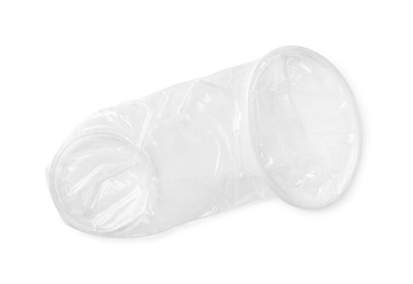 Photo of Unrolled female condom isolated on white, top view. Safe sex
