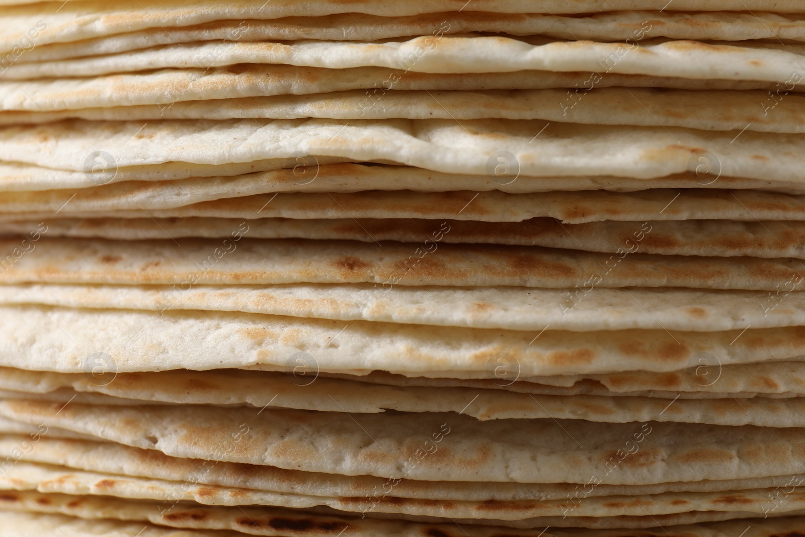 Photo of Stack of tasty tortillas as background, closeup