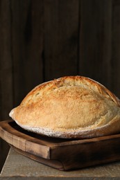 Photo of Freshly baked sourdough bread on wooden table