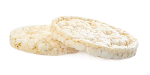 Photo of Puffed rice cakes isolated on white. Healthy snack